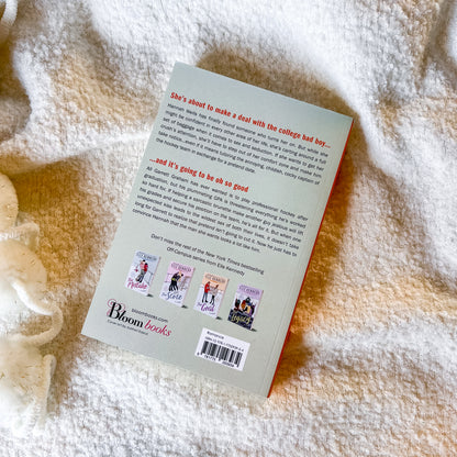 Back cover of a book by Bloom Books on a textured surface