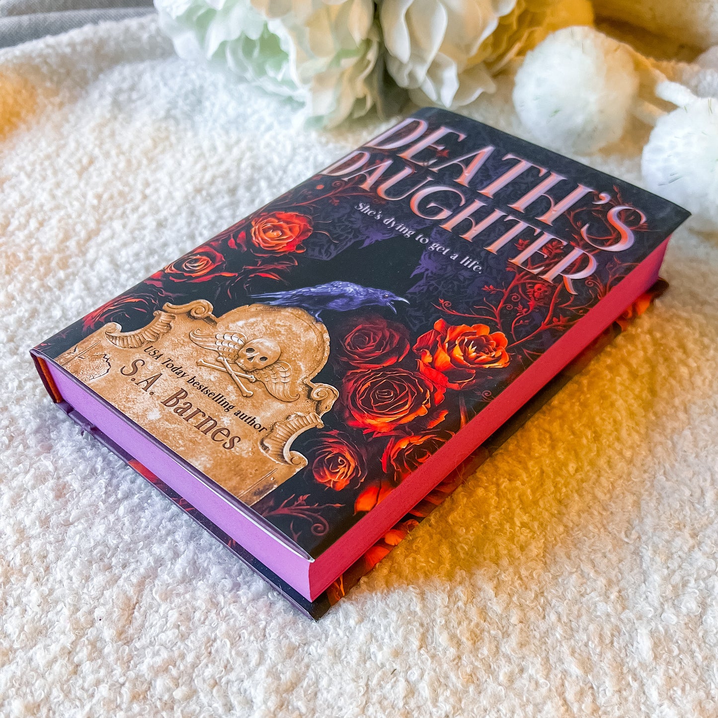 Book cover of 'Death's Daughter' with roses and a gravestone design on a white background