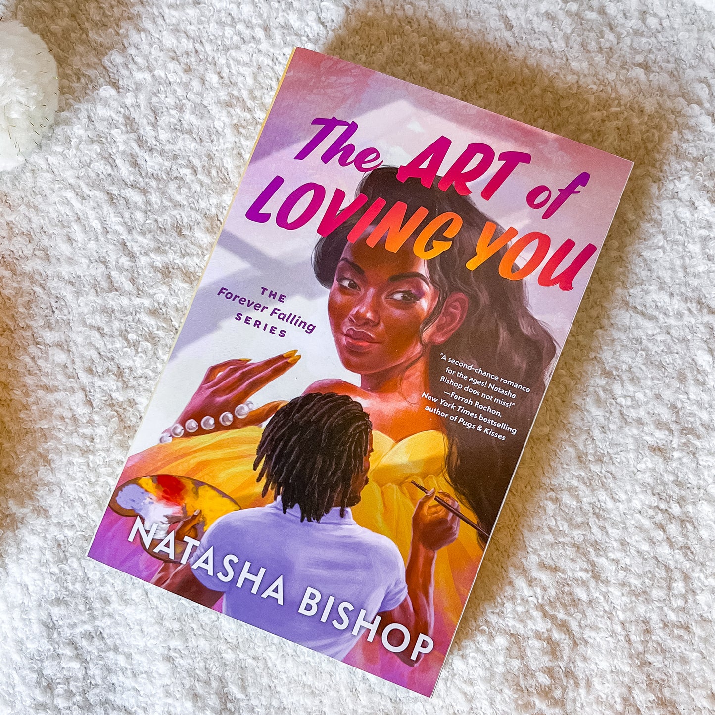 Book "the art of loving you" by Natasha Bishop on a light textured background.