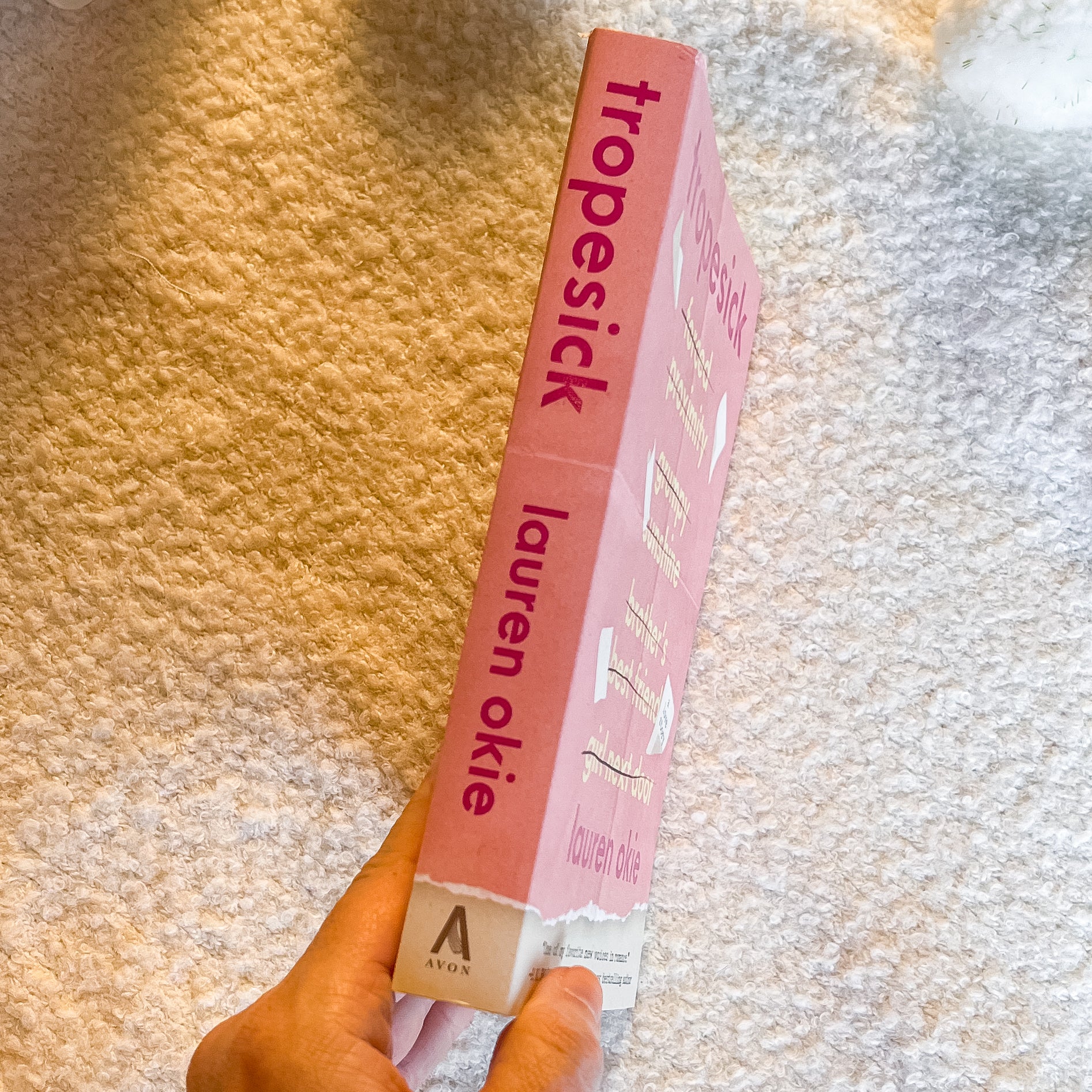 'tropesick' and 'lauren okie' branding held against a textured background.