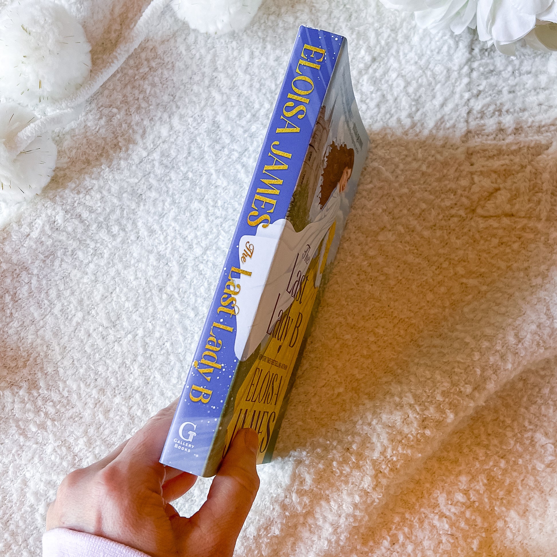 Spine of 'The Last Lady B' by Eloisa James with a woman in a yellow dress and castle in the background.