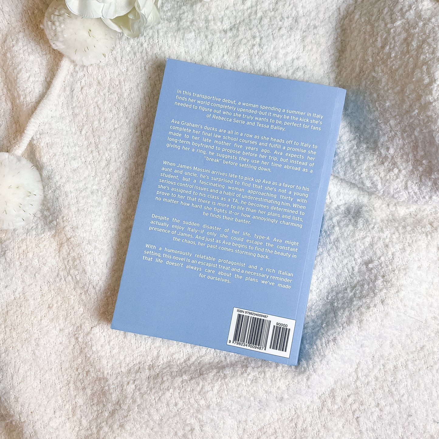 Book back cover with text on a textured white surface