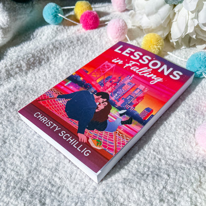 Book cover of 'Lessons in Falling' by Christy Schillig with a romantic illustration on a white background.