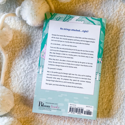The back of the "The summer proposal" by Vi Keeland book on a soft white background.