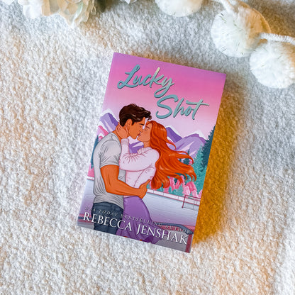 Book  'Lucky Shot' by Rebecca Jenshak on a textured white background