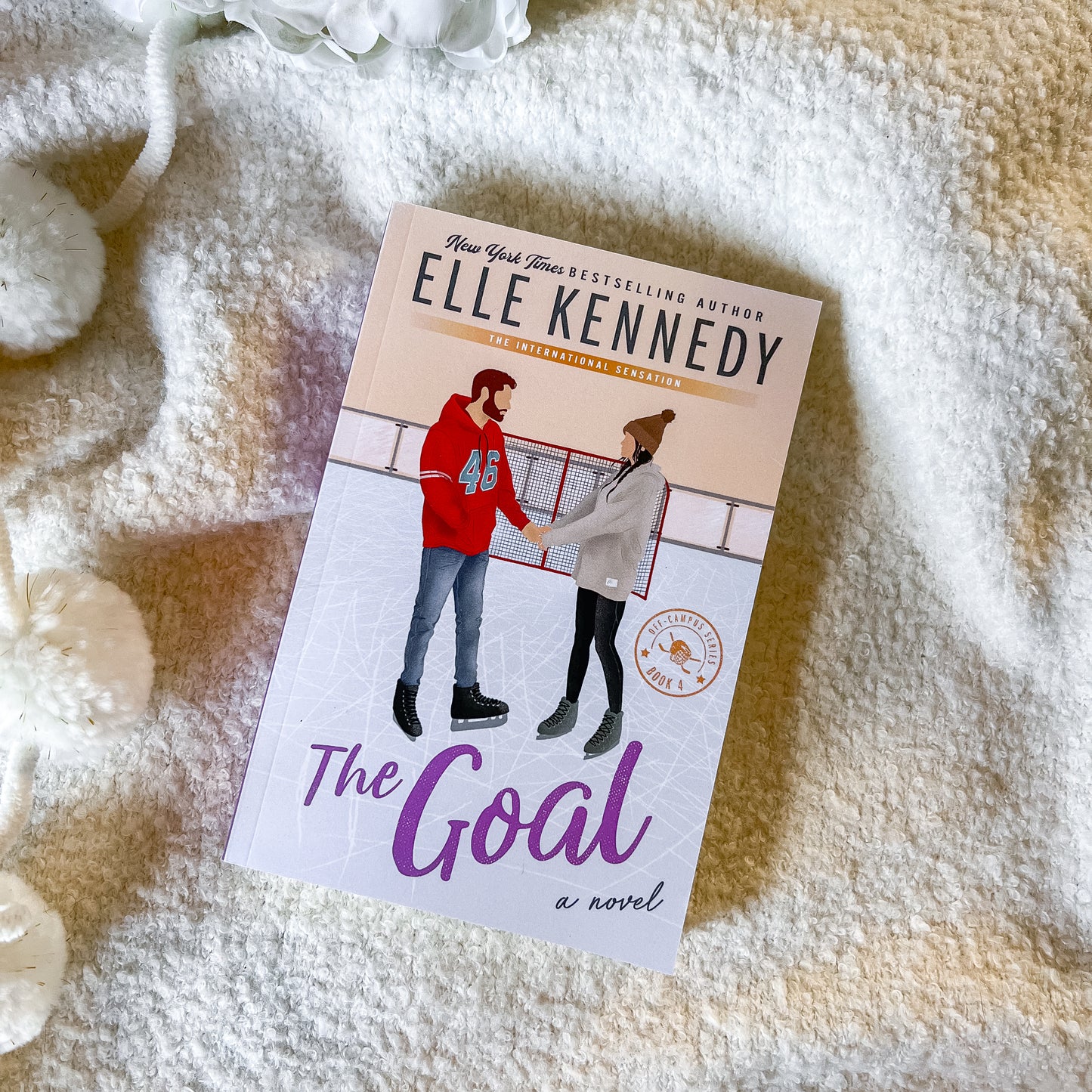 Book titled 'The Goal' by Elle Kennedy on a textured surface