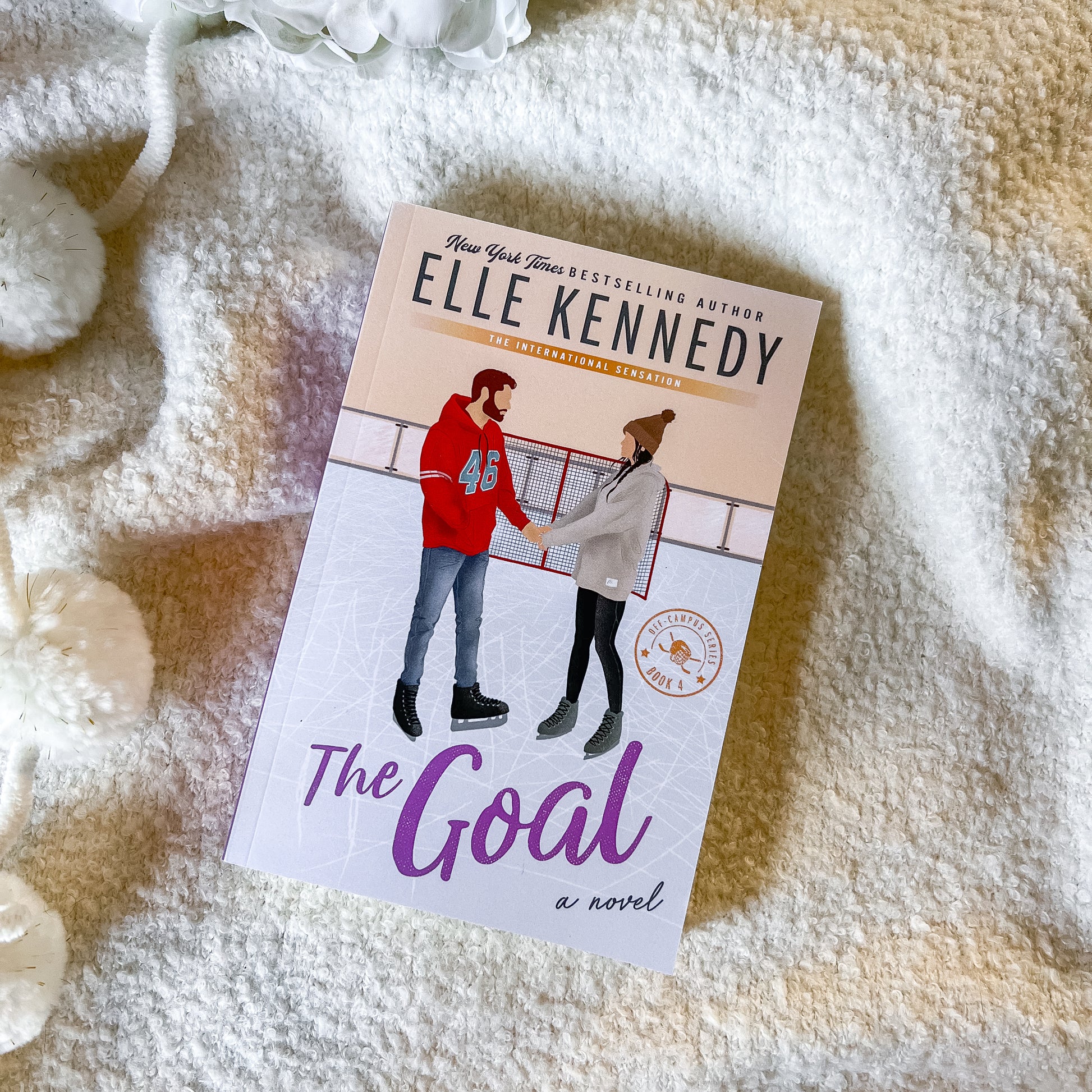Book titled 'The Goal' by Elle Kennedy on a textured surface