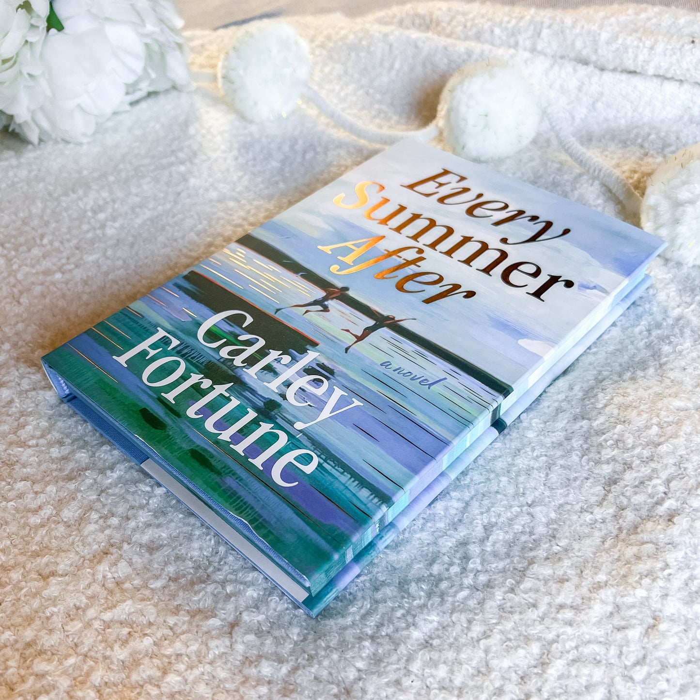 Book titled 'Every Summer After' by Carley Fortune on a textured surface