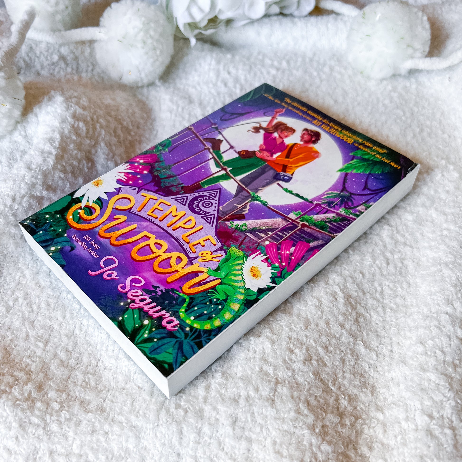 Colorful book titled 'Temple of Swoon' on a white textured surface