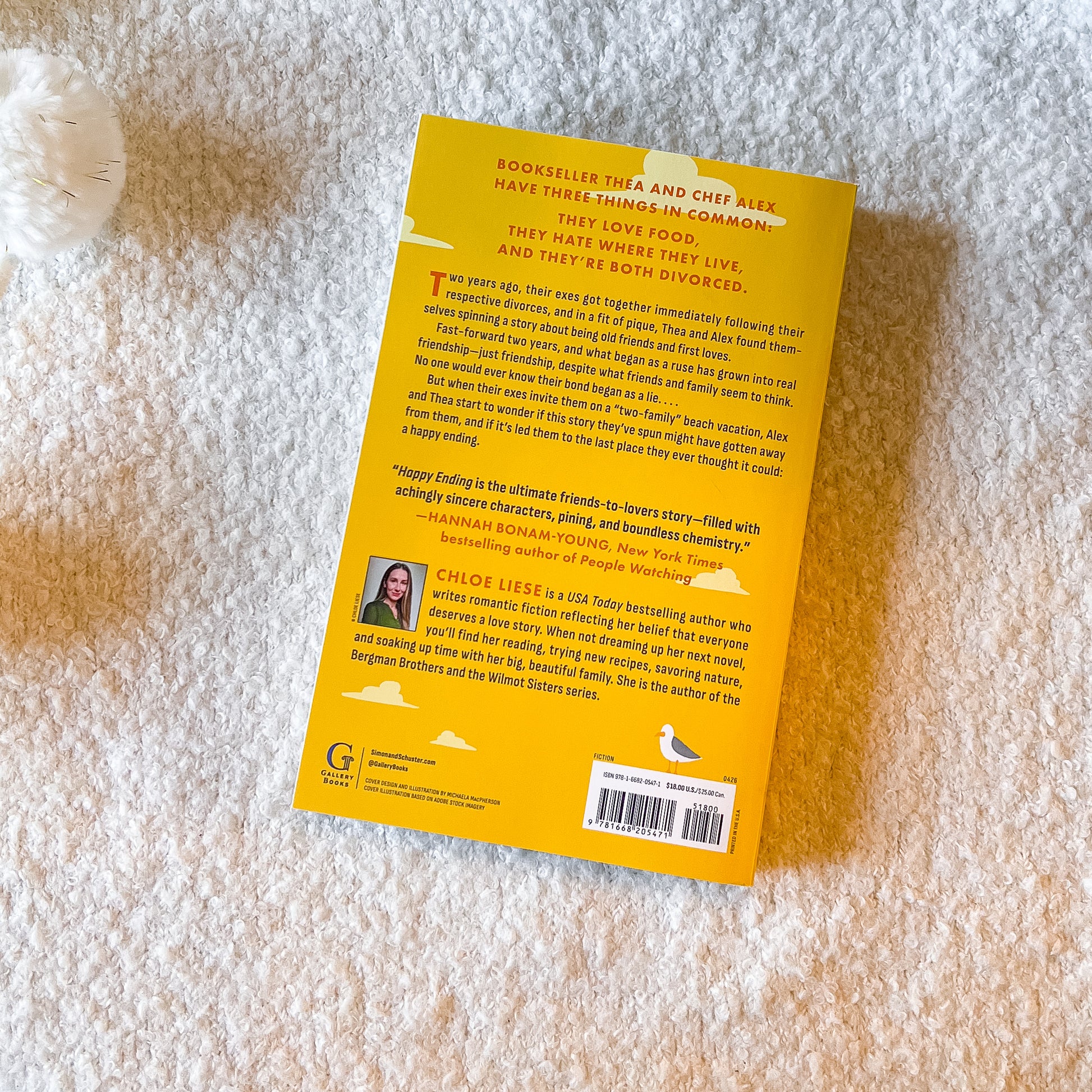 the back of Happy Ending book by Chloe Liese on a light textured background