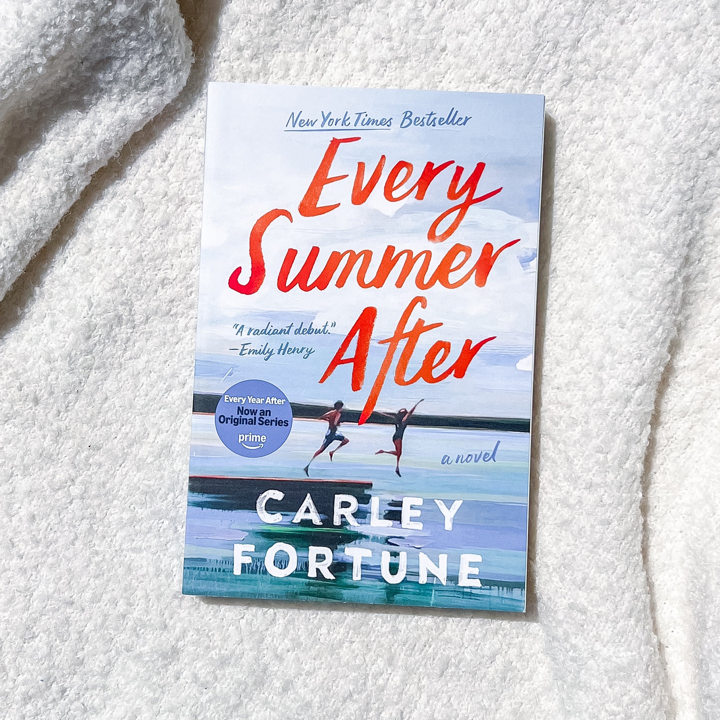 Book titled 'Every Summer After' by Carley Fortune on a textured white surface