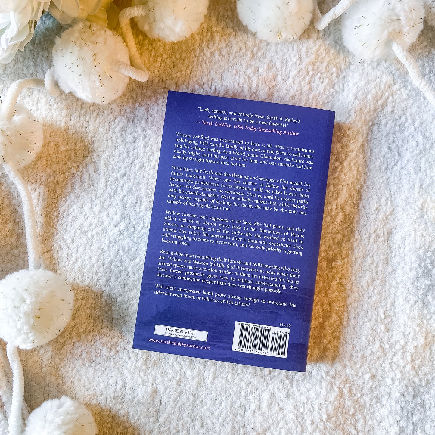 The back of the book "tattered tides" by Sarah A. Bailey