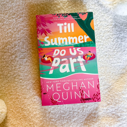 Book titled 'Till Summer Do Us Part' by Meghan Quinn on a textured surface