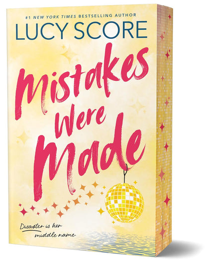 Book cover of 'Mistakes Were Made' by Lucy Score with a yellow background and disco ball.