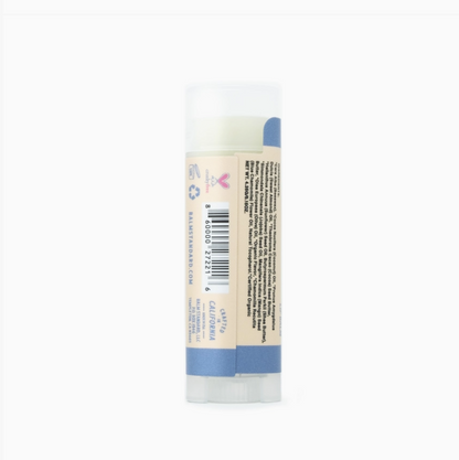 A single tube of lip balm with a beige label and blue accents, shown upright against a plain white background.