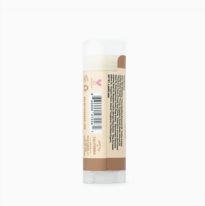 A single tube of lip balm with a beige label and brown color swatches, shown from the back on a plain white background.
