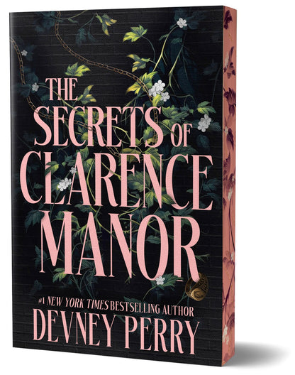 The book cover for 'The Secrets of Clarence Manor' by Devney Perry, featuring a dark wood-textured black background with pink title lettering and green floral vines with white blossoms.