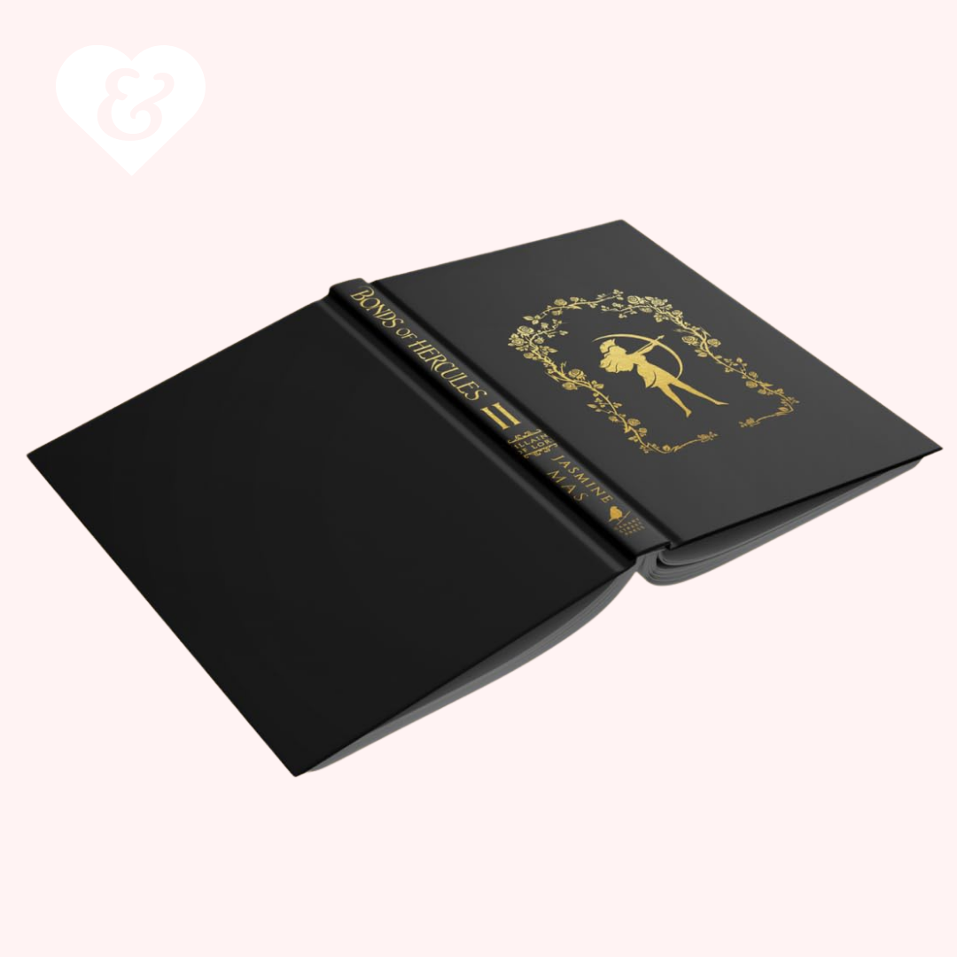 Black notebook with gold embossed design on a white background