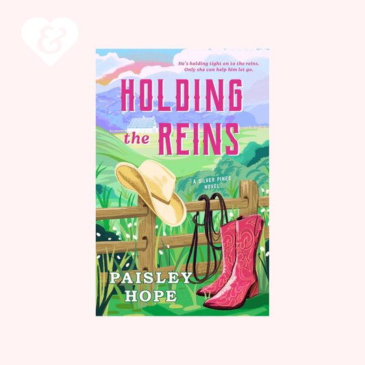 Book cover of 'Holding the Reins' by Paisley Hope with a cowboy hat and pink boot on a green background.
