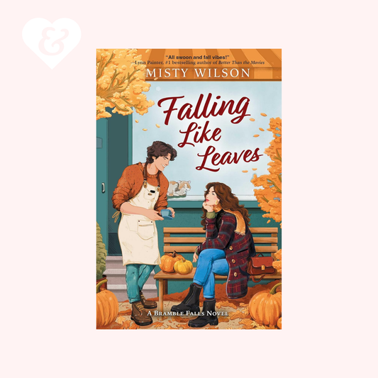 Book cover of 'Falling Like Leaves' by Misty Wilson with two people sitting on a bench in an autumn setting.