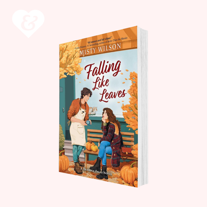 Book cover of 'Falling Like Leaves' by Misty Wilson with two people on a bench and autumn elements.