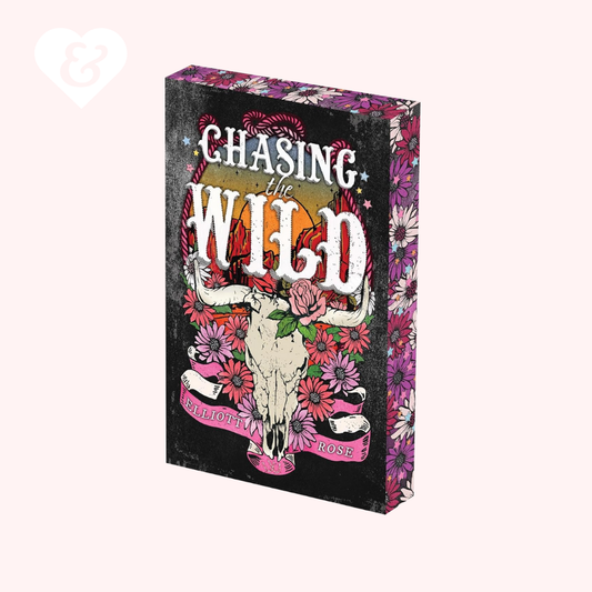 Book titled 'Chasing the Wild' with a skull and floral design on a black background