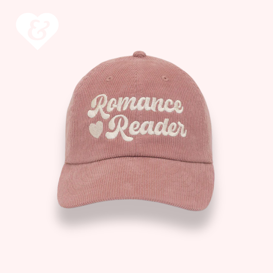 Pink cap with 'Romance Reader' text on a white background