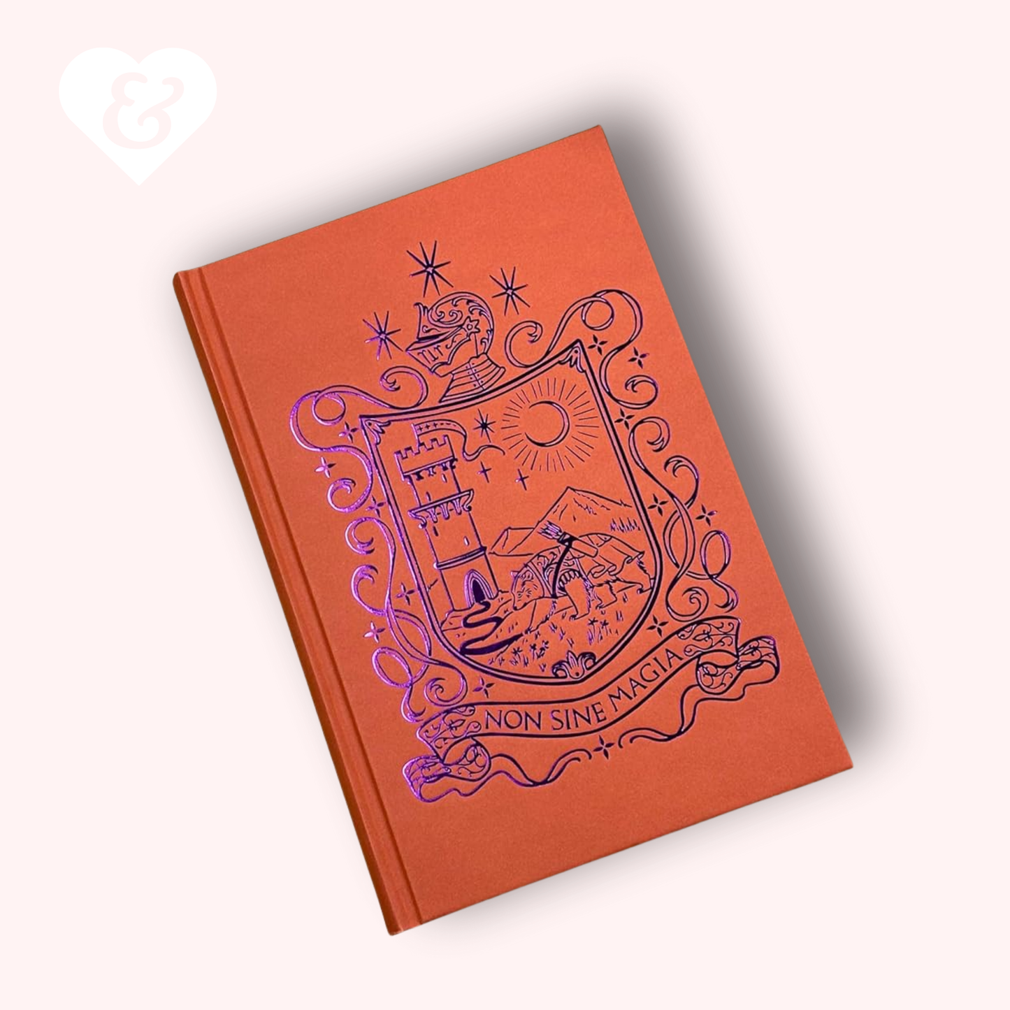 Orange book with purple crest design on a white background