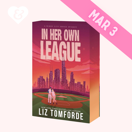 Book cover of 'In Her Own League' by Liz Tomforde with a city skyline and baseball field illustration.