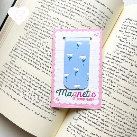 Magnetic bookmark with floral design on an open book