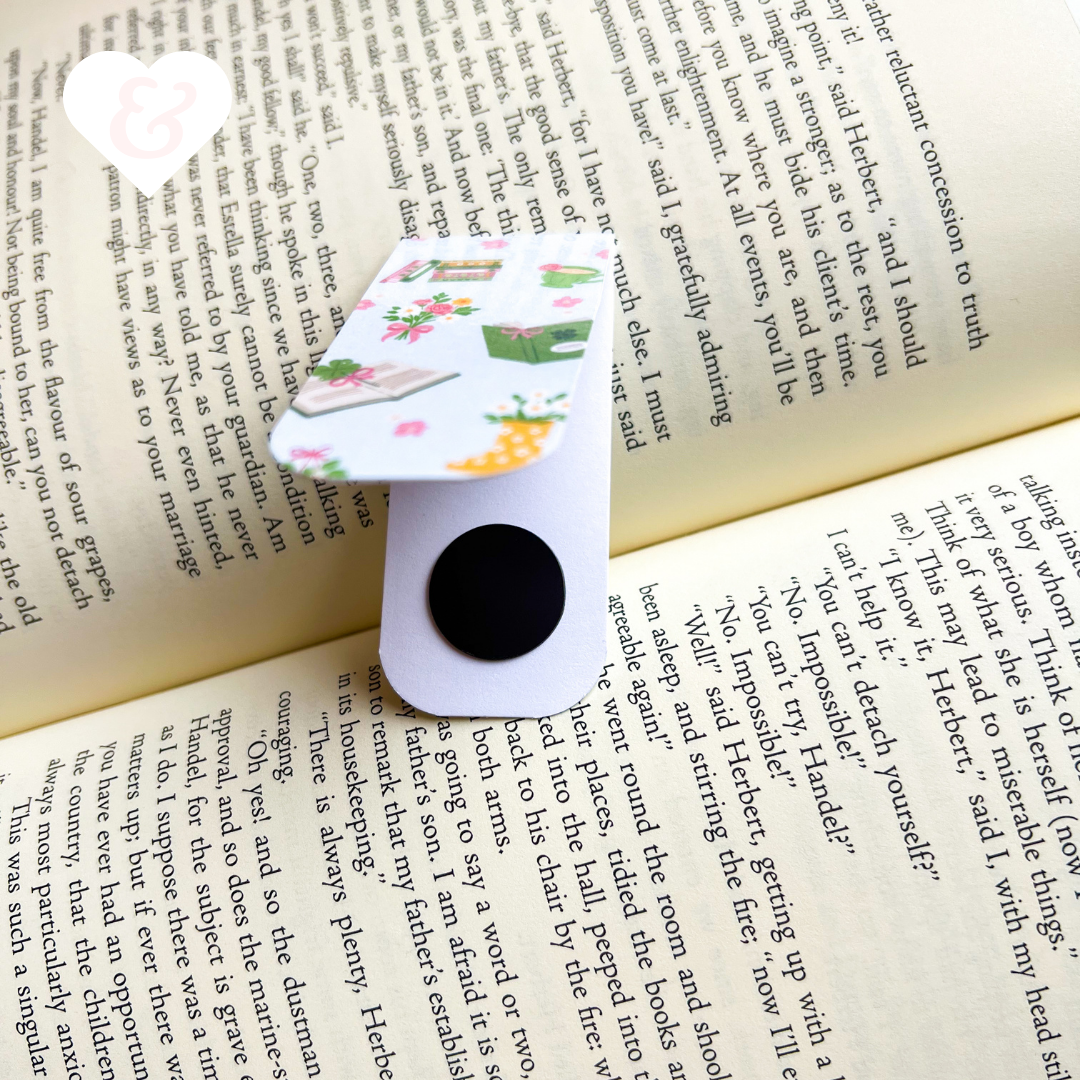 Floral-patterned paper clip on an open book