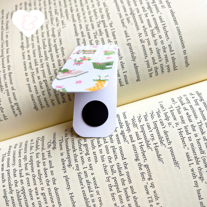 Floral-patterned paper clip on an open book