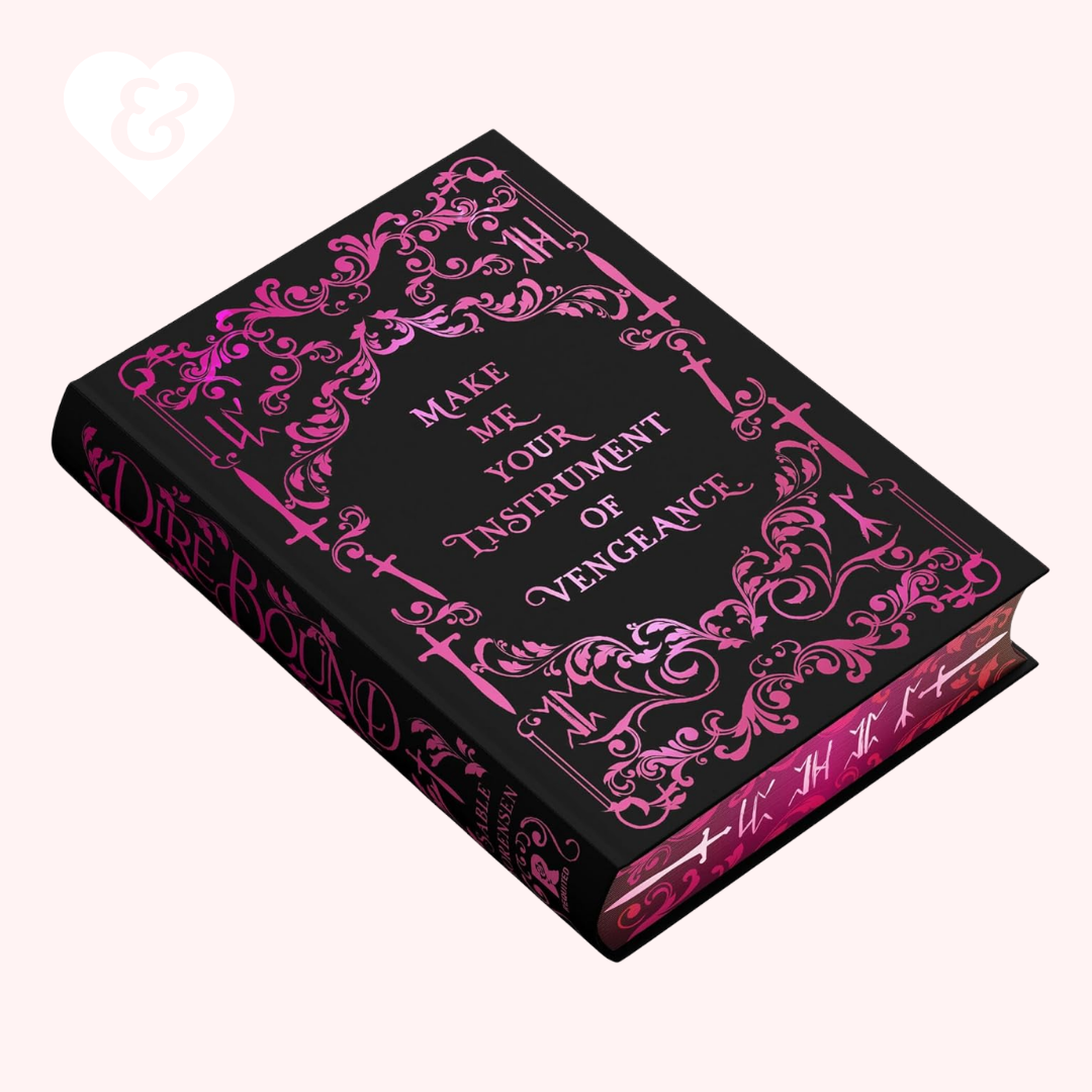 Book with pink decorative text and design on a black background