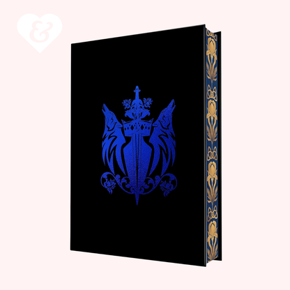 Decorative black book with blue emblem and gold detailing on a white background