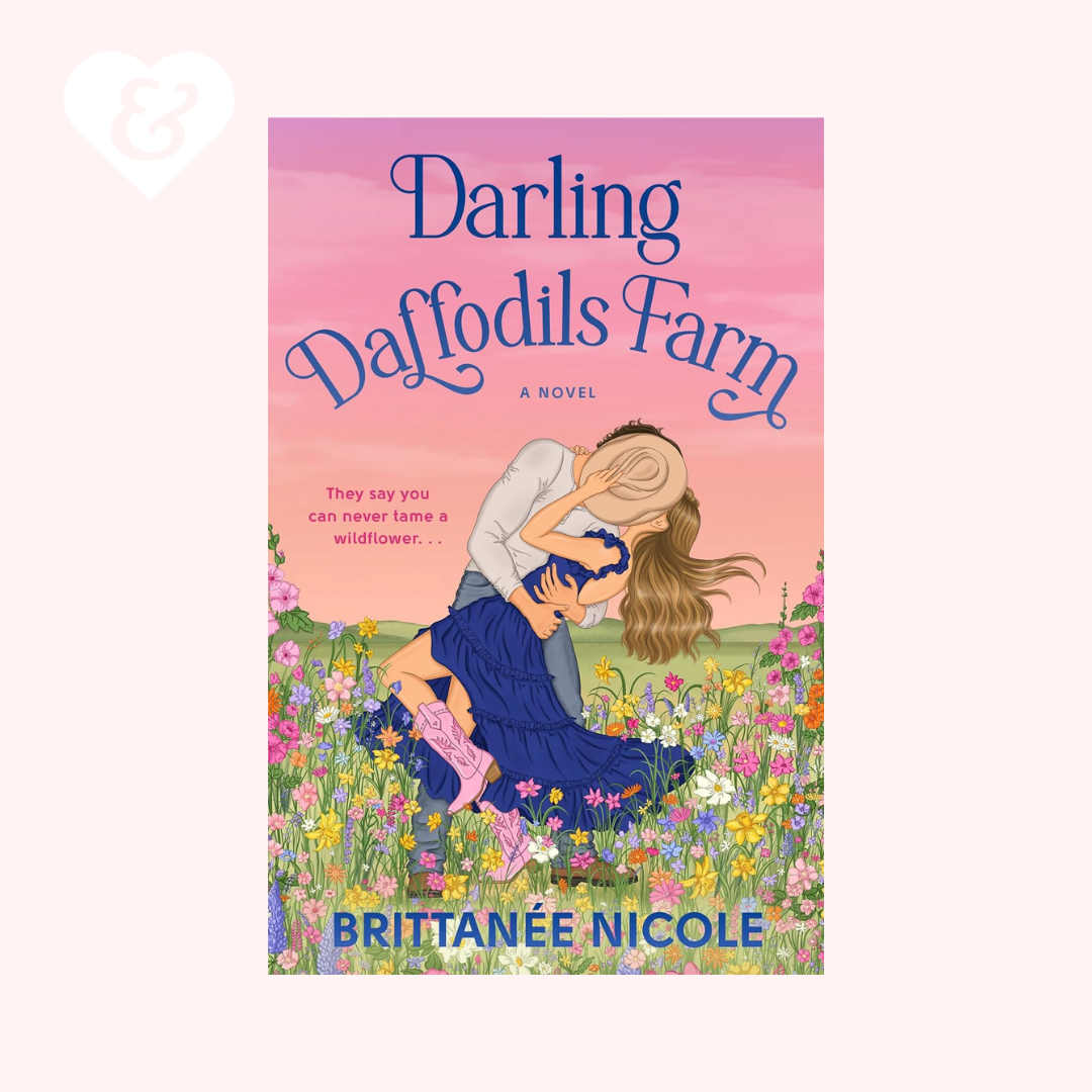 Book cover of 'Darling Daffodils Farm' with a couple in a field of flowers and a pink gradient background.