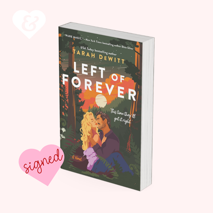 The book "left of forever" by Tarah DeWitt, showing a couple embracing in a forest. The book has a heart on it that says "signed".