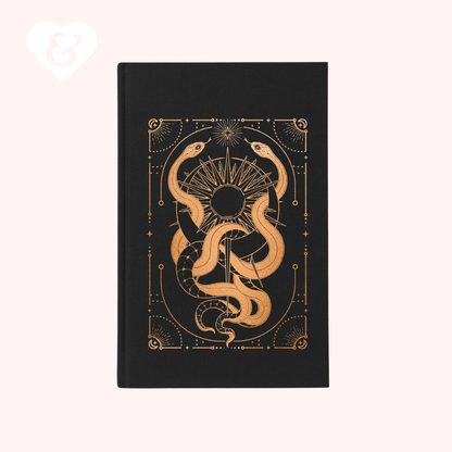 Black notebook with gold snake design on a white background