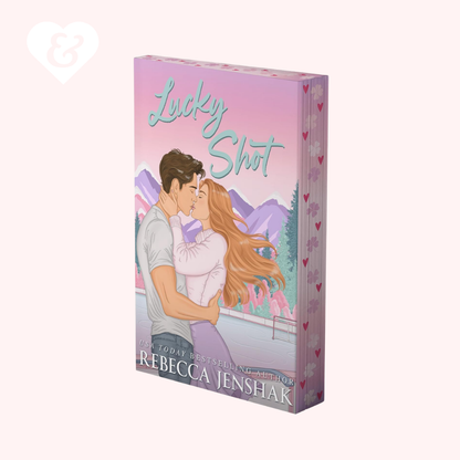 Book cover of 'Lucky Shot' by Rebecca Jenshak with a couple embracing on a pink background.