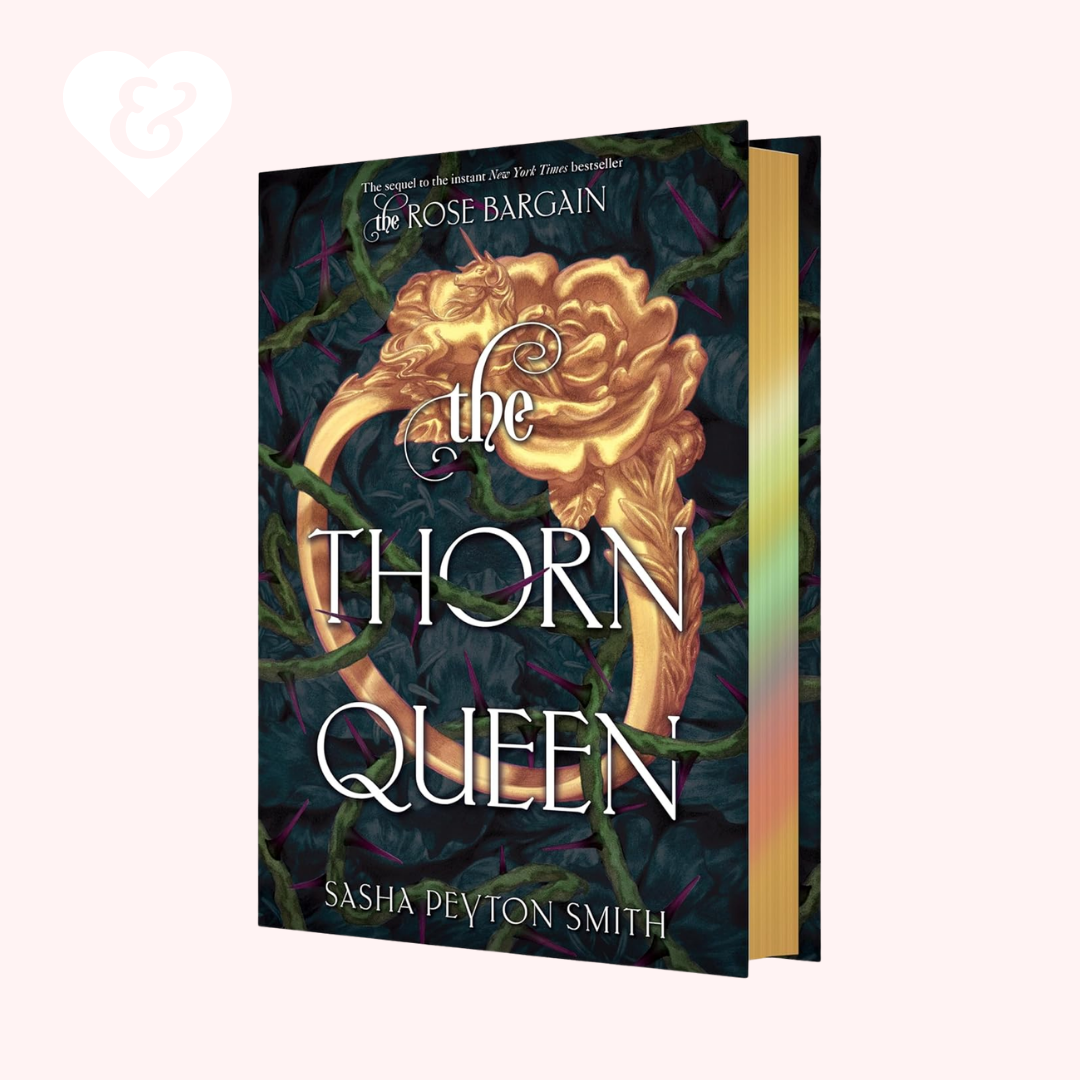 Book "the thorn queen" by sasha peyton smith on a light pink background