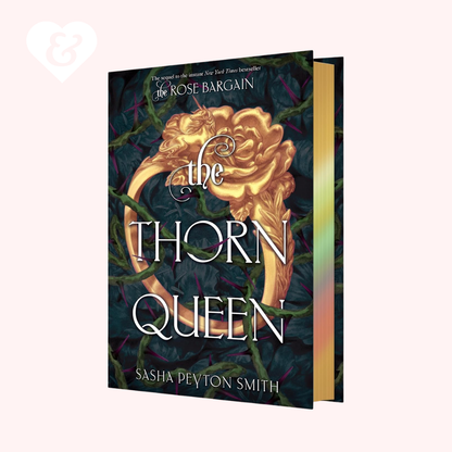 Book "the thorn queen" by sasha peyton smith on a light pink background