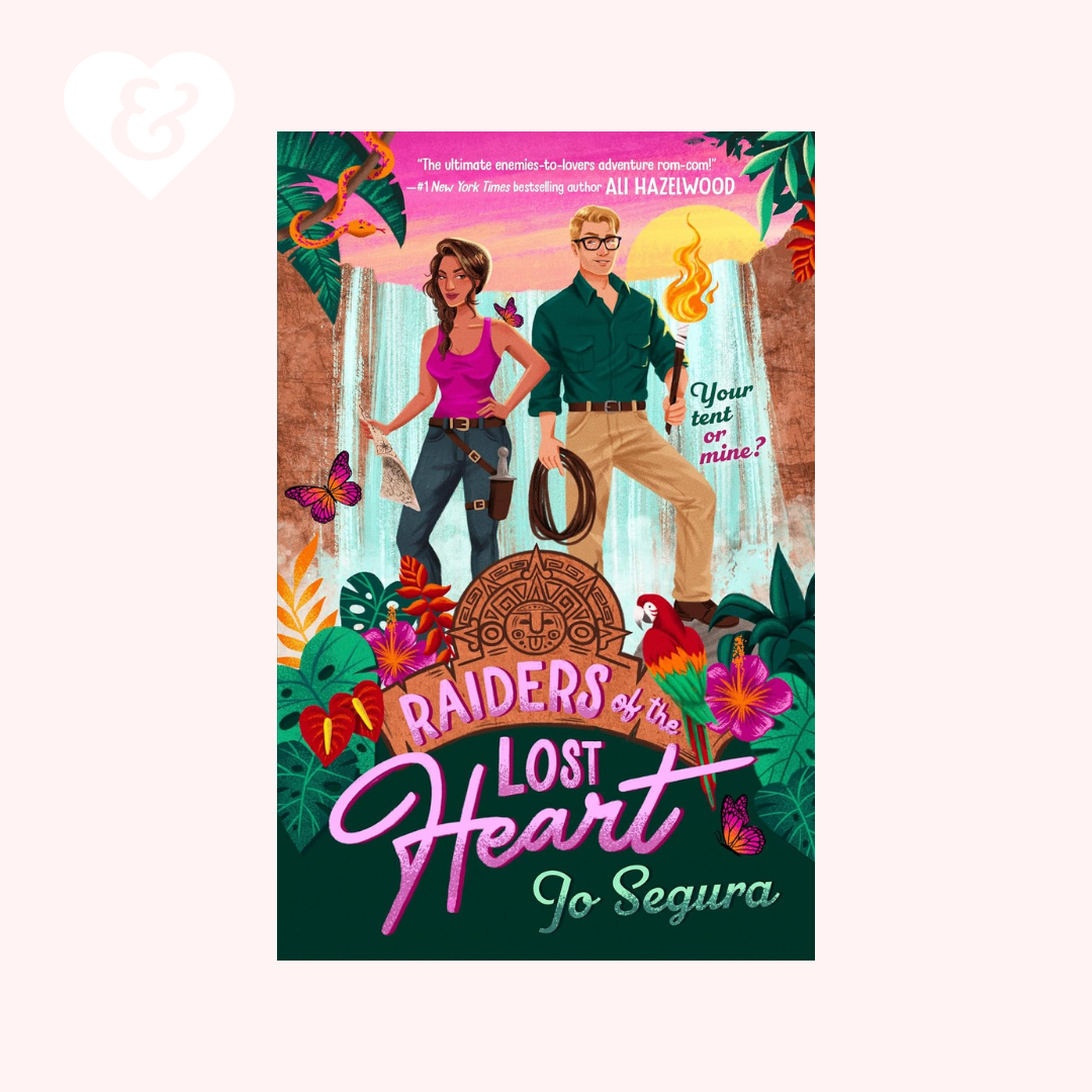 Book cover of 'Raiders of the Lost Heart' by Jo Segura with a couple and tropical elements.