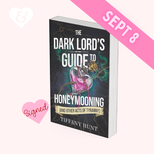 Book titled 'The Dark Lord's Guide to Honeymooning (and Other Acts of Tyranny)' by Tiffany Hunt with a pink banner and heart on a white background.