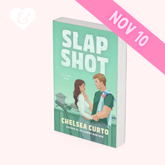 Book cover of 'Slap Shot' by Chelsea Curto with a couple embracing on a kitchen counter, set against a light green background.