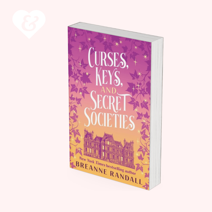 Book titled 'Curses, Keys, and Secret Societies' by Breanne Randall with a purple and pink cover on a white background.