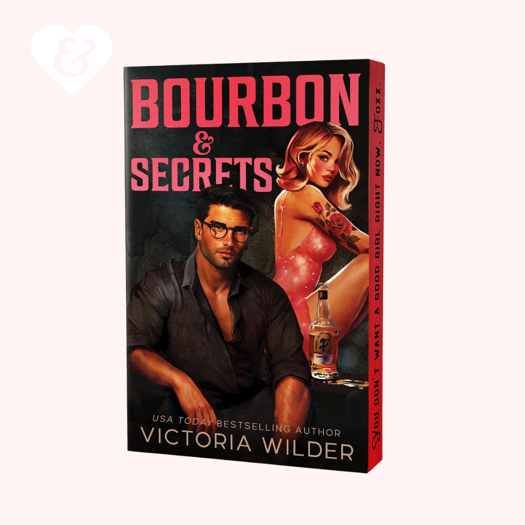 Book cover of 'Bourbon & Secrets' by Victoria Wilder with a man and woman on the cover.