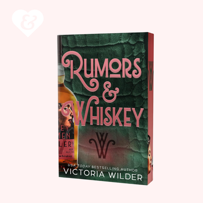 Book cover of 'Rumors & Whiskey' by Victoria Wilder with a green and pink color scheme.