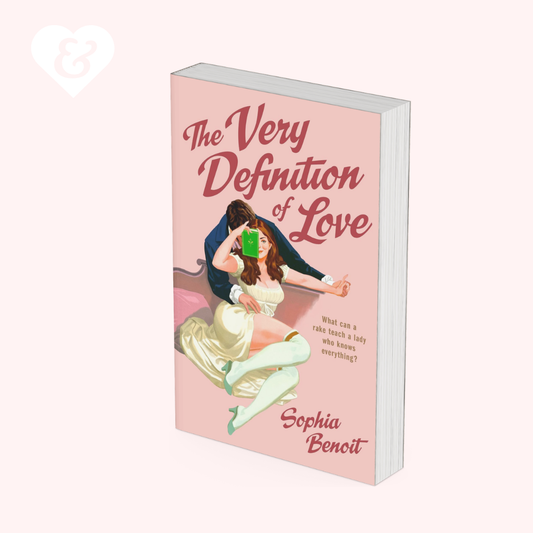 A book, "the very definition of love" by Sophie Benoit, showing a couple embracing on the cover.