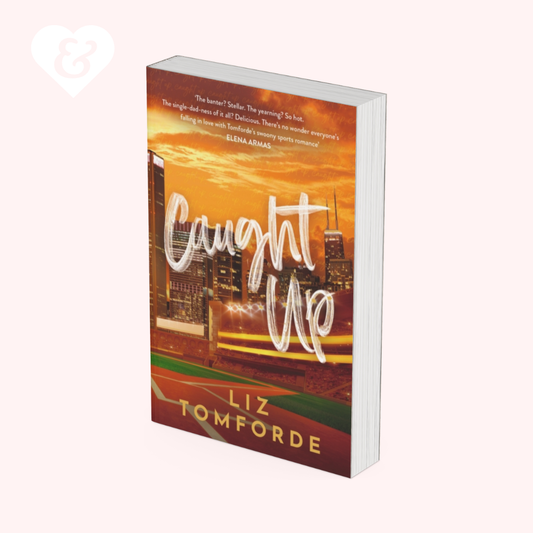 Book titled 'Caught Up' by Liz Tomforde with a cityscape design on the cover.