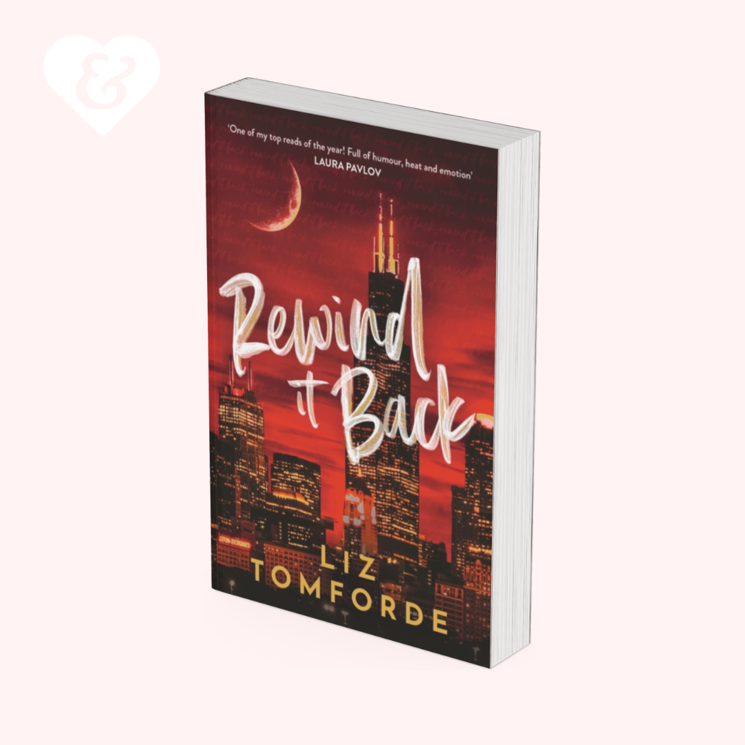Book titled 'Rewind It Back' by Liz Tomforde with a cityscape design on the cover.
