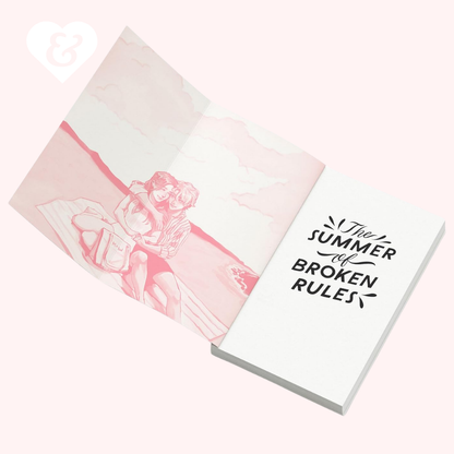 A white book with black text reading 'The Summer of Broken Rules' shown open on a pale pink background, alongside a matching pink illustrated sheet.